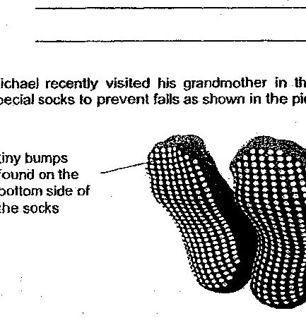 A pair of special socks viewed from the bottom side, showing tiny bumps found on the bottom side of the socks. The socks have a textured, bumpy pattern across the sole.